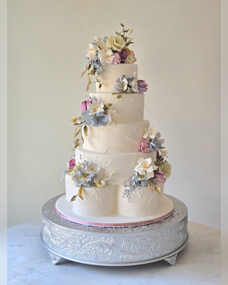 Hand-crafted sugar flowers in soft lavender and blue