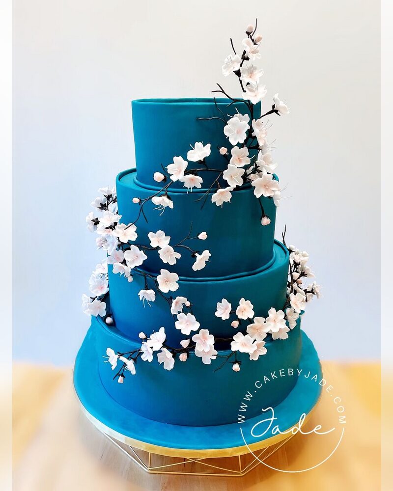 Teal tiers with sugar cherry blossoms