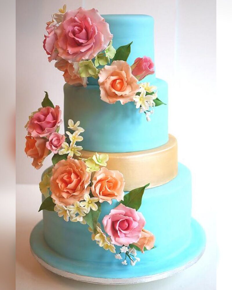 Aqua and gold with cascading sugar roses