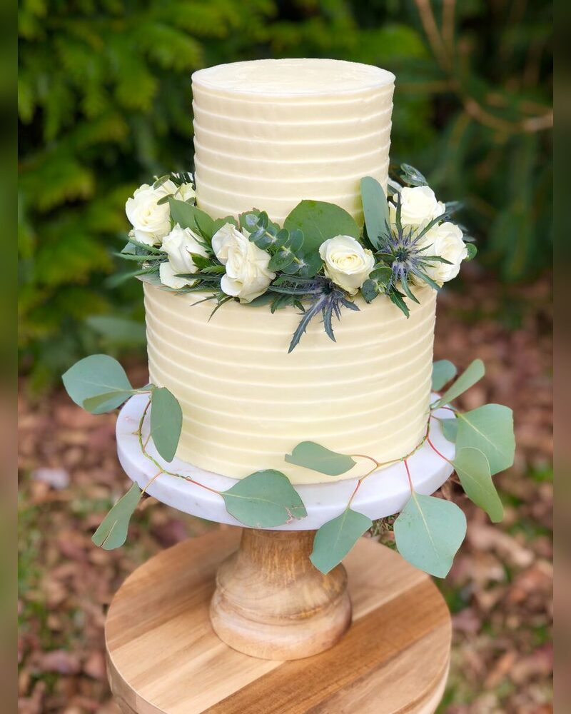 Ribbed buttercream with eucalyptus and white roses