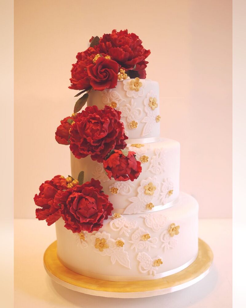 Red sugar peonies on white lace